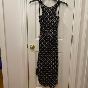 Free people size small black dress with silver flowers, crisscross back
